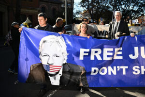 Stella Assange, (centre) wife of imprisoned journalist, publisher and Wikileaks founder, Julian Assange, and lawyer Stephen Kenny (right) march during the Free Assange Quad Rally in Sydney, Wednesday, May 24, 2023.