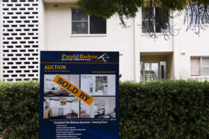 A ’SOLD’ sign is seen outside an apartment block in Canberra