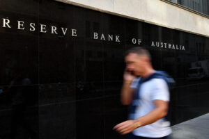 A pedestrian walks past the Reserve Bank of Australia (RBA) building in Sydney, Tuesday, February 4, 2020.