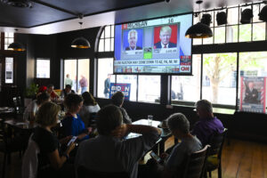 Patrons watch the US election day live results during a US election watch party at PJ O’Reilly’s Bar in Canberra, Wednesday, November 4, 2020.