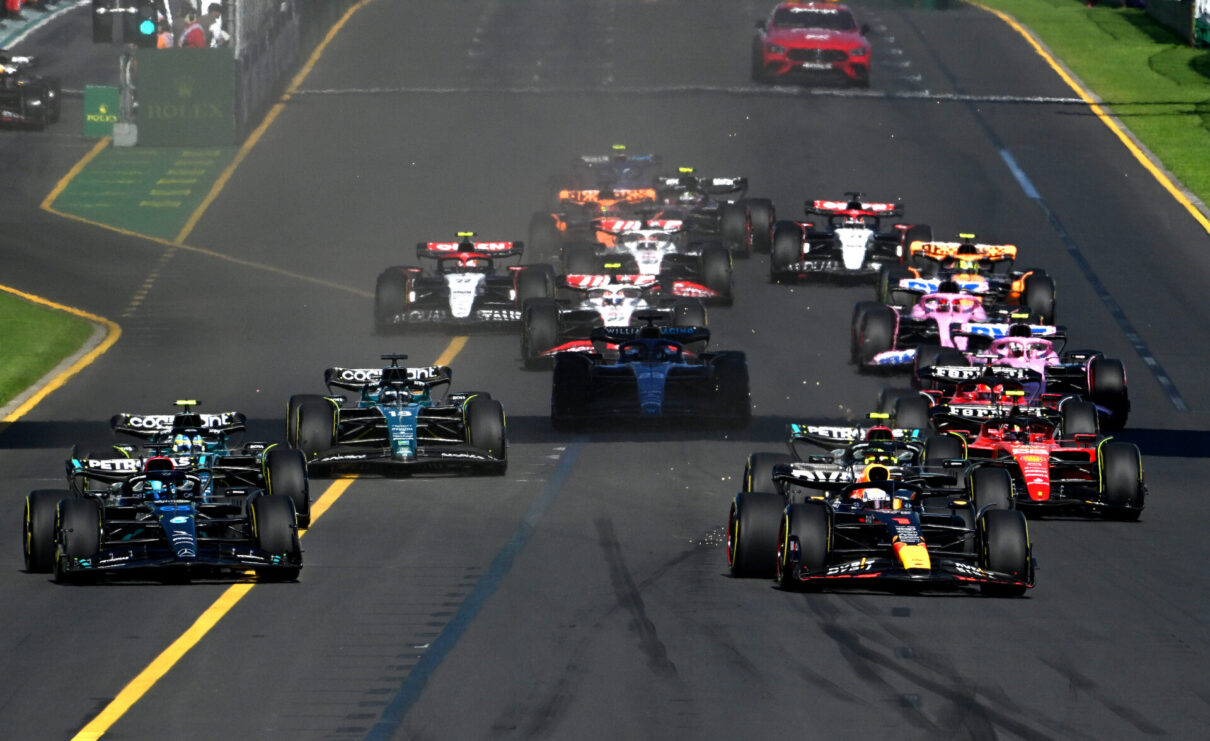 Mercedes driver George Russell of Great Britain (left) passes Red Bull driver Max Verstappen of Netherlands (right) at the start of the 2023 Australian Grand Prix at the Albert Park Circuit in Melbourne, Sunday, April 2, 2023. (AAP Image/James Ross) NO ARCHIVING, EDITORIAL USE ONLY
