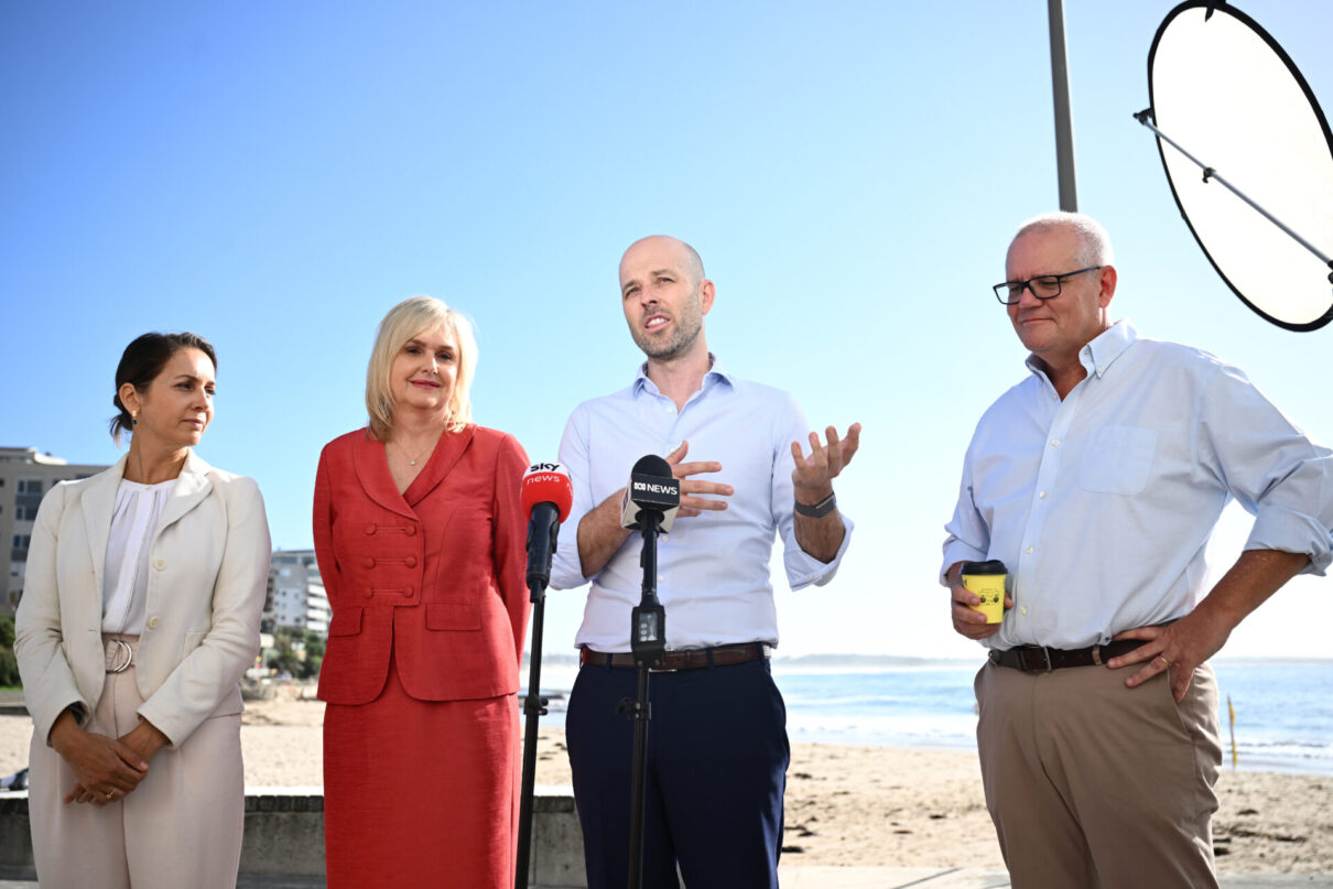 Liberal candidate for Cook, Simon Kennedy, (centre) speaks to media along with his wife Nila, (left) Member for Hughes Jenny Ware and outgoing Member for Cook Scott Morrison, at Cronulla Pavilion in Sydney, Tuesday, March 5, 2024. (AAP Image/Dan Himbrechts) NO ARCHIVING