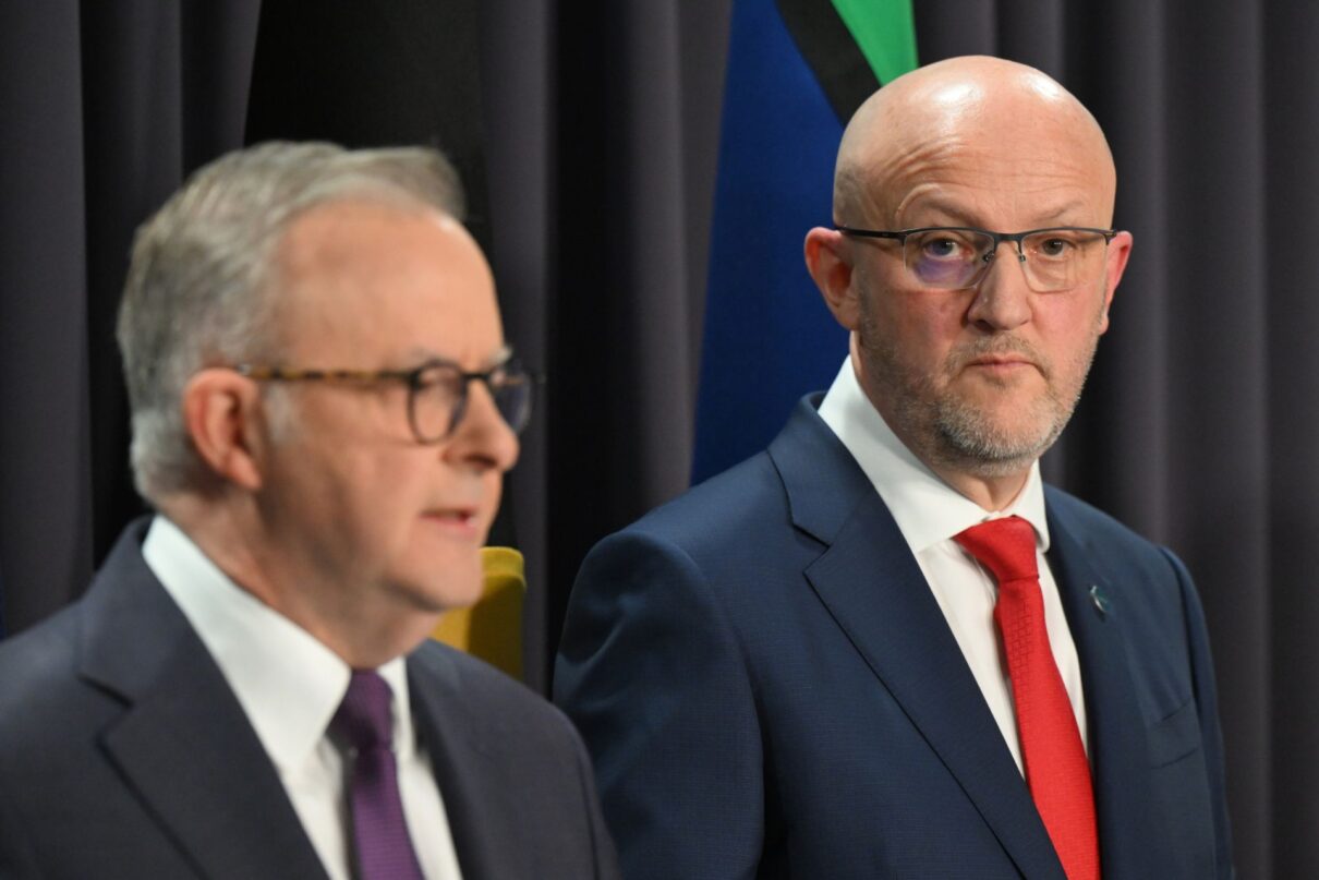 ASIO Director-General Mike Burgess listens to Australian Prime Minister Anthony Albanese during a press conference at Parliament House in Canberra, Monday, August 5, 2024.