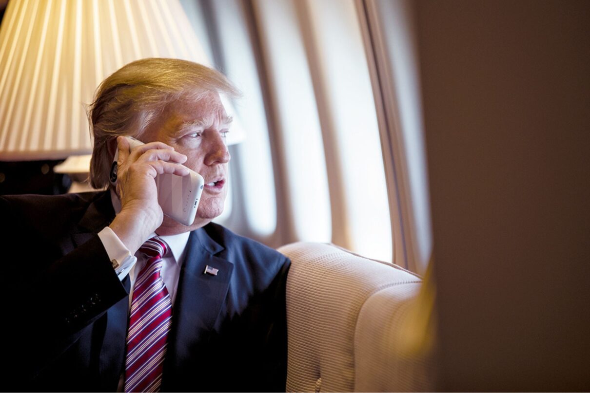 President Donald Trump talks on the phone aboard Air Force One during a flight to Philadelphia, Pennsylvania, to address a joint gathering of House and Senate Republicans, Thursday, January 26, 2017. This was the President’s first trip aboard Air Force One. (Official White House Photo by Shealah Craighead, https://flickr.com/photos/whitehouse45/34252546901/in/album-72157680590531032)