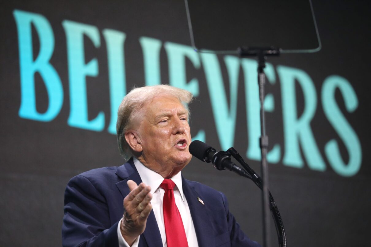 Former President of the United States Donald Trump speaking with attendees at The Believers Summit at the Palm Beach County Convention Center in West Palm Beach, Florida.