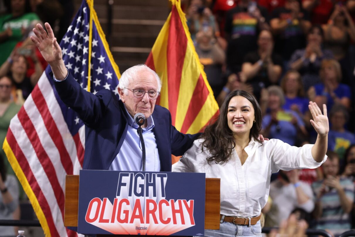 U.S. Senator Bernie Sanders and U.S. Congresswoman Alexandria Ocasio-Cortez speaking with attendees at a "Fight Oligarchy" rally at Mullett Arena in Tempe, Arizona.