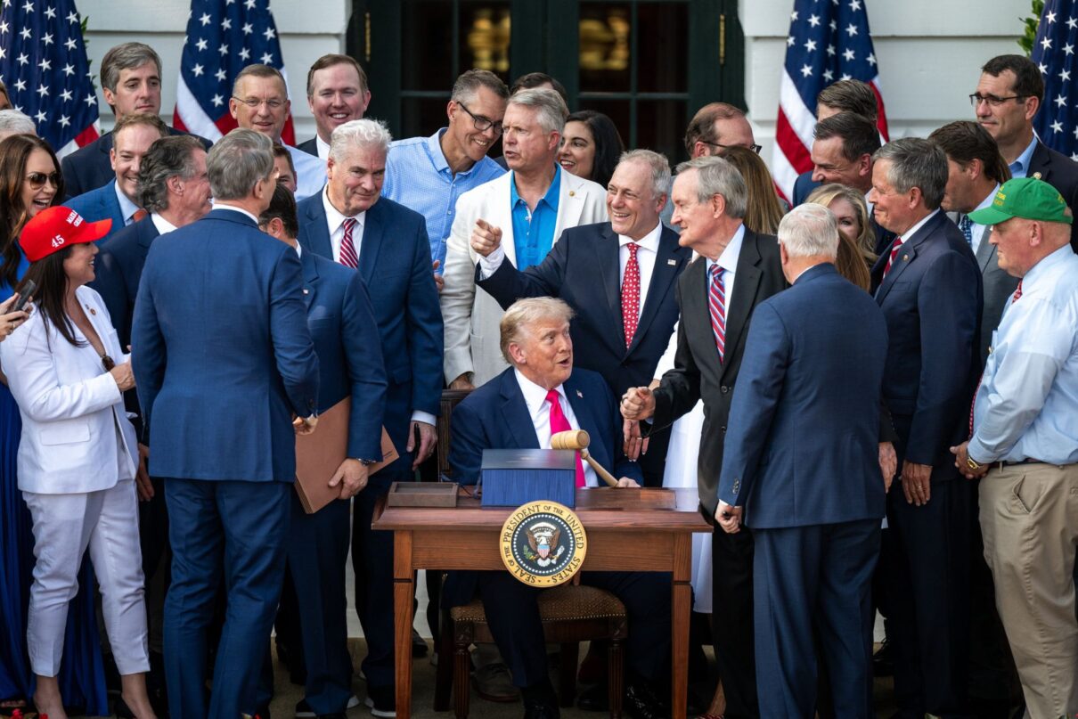President Donald Trump speaks with Cabinet members and others after signing the One Big Beautiful Bill Act on the South Lawn of the White House, Friday, July 4, 2025, during the 4th of July picnic. (Official White House Photo by Molly Riley)