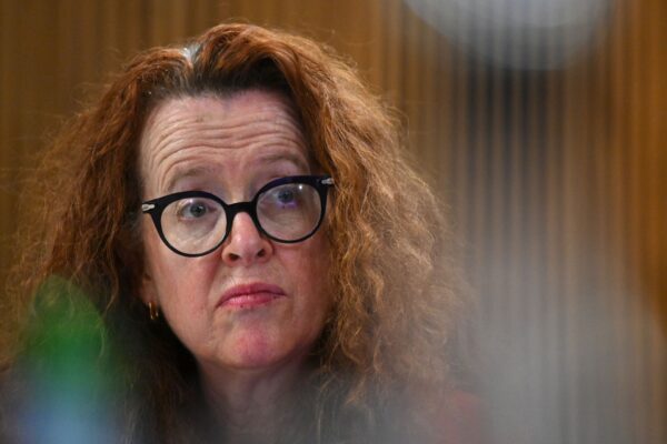 Incoming Vice-Chancellor of the Australian National University Genevieve Bell listens to outgoing Vice-Chancellor Professor Brian P. Schmidt address the National Press Club of Australia in Canberra, Tuesday, December 5, 2023.