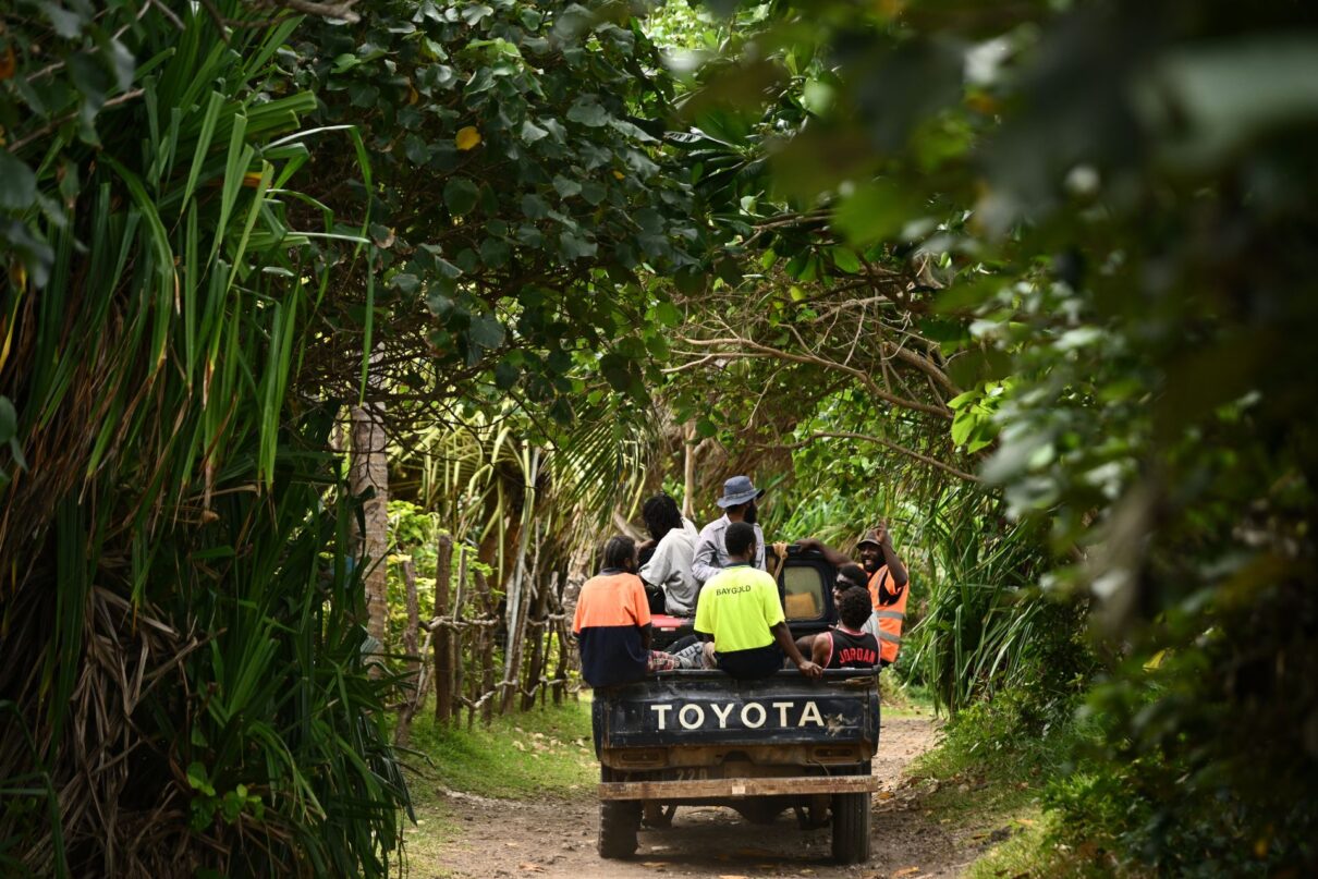 Locals return from work on Nguna Island, Vanuatu, Thursday, July 17, 2025.