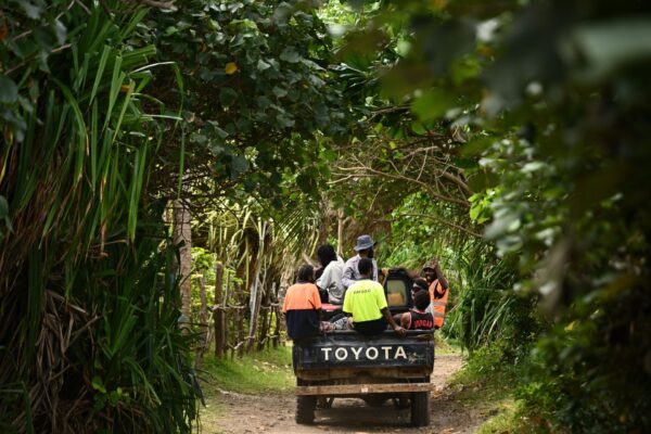 Locals return from work on Nguna Island, Vanuatu, Thursday, July 17, 2025.