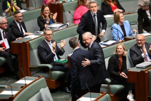 Australian Treasurer Jim Chamers and Australian Prime Minister Anthony Albanese leave after the passing of the Tax Reform Bill in the House of Representatives at Parliament House in Canberra, Thursday, June 25, 2026.